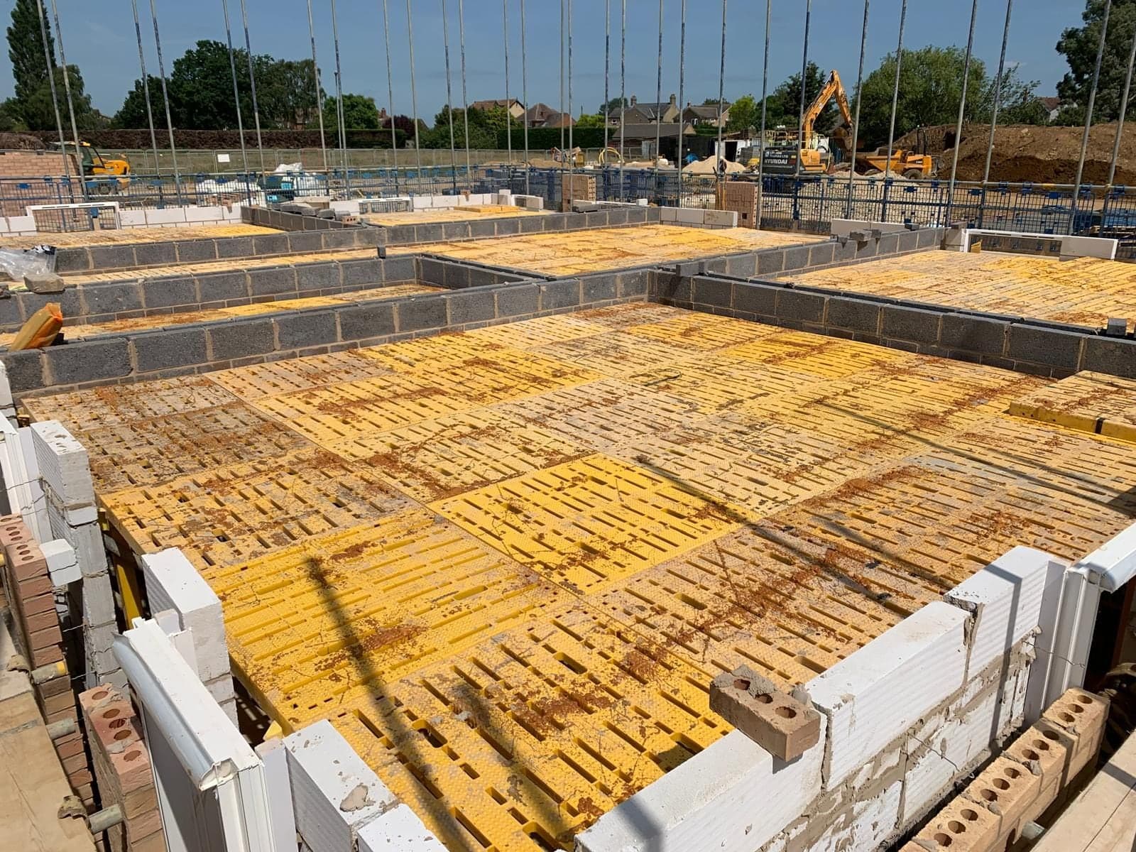 Completed yellow Trad Deck safety platform across a protected UK housebuilding floor opening